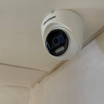 hikvision white camera on ceiling of bar